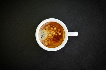 Espresso coffee in small white cup