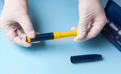 A man in medical gloves holds a syringe for subcutaneous injection of hormonal drugs in the IVF protocol in vitro fertilization Pregnancy, help to his wife.