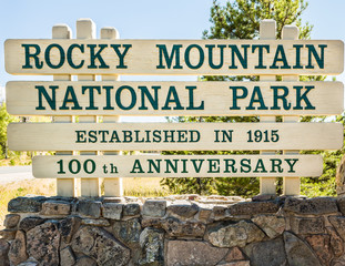Sign at entrance of 100th anniversary of Rocky Mountain National Park, USA