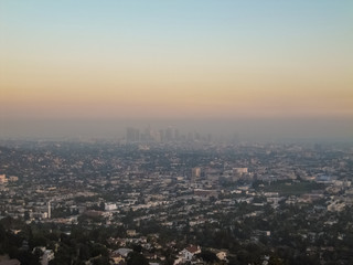 Fototapeta na wymiar Cityscape or skyline of the LA city with smog during sunrise or sunset in Los Angeles