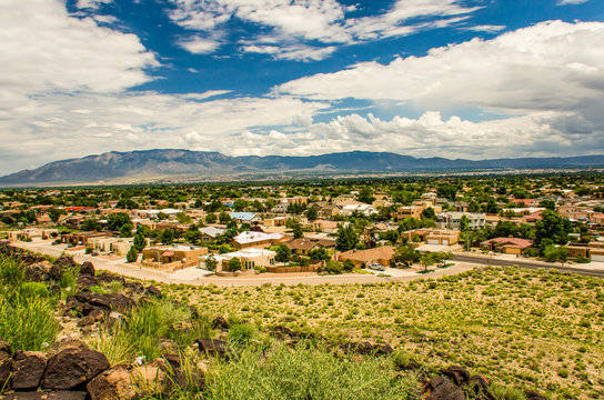 Skyline or cityscape of city with residential suburban houses near Petroglyph National Monument in Albuquerque, USA