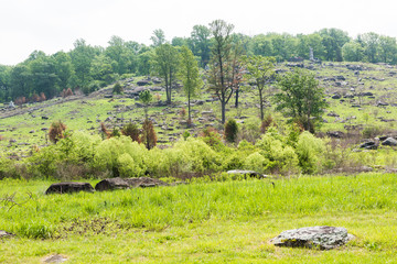 Little Round Top New York Monument in Gettysburg battlefield national park during summer with people