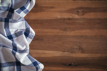 Top view of napkin on empty old wooden background