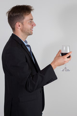 Young businessman with a wine bottle