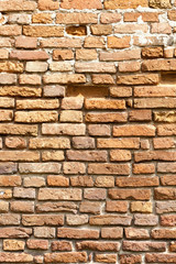 Brick wall of an old building close up