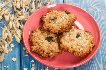 Fresh oatmeal cookies and ears of oat, healthy dessert concept