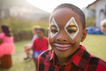 Close up portrait of boy with face paint