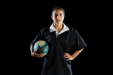 Portrait of female athlete with rugby ball