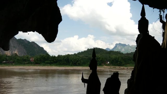 Silhouette from buddha statues in the Pak Ou Caves, Laos