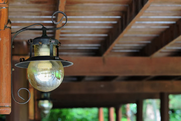The old lamp on the old wooden pole.