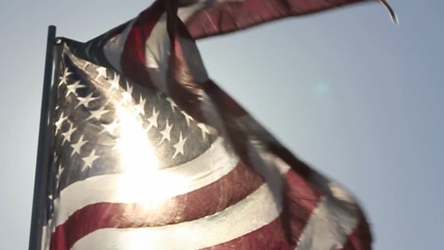 American Flag Waves Backlit in Slow Motion.
