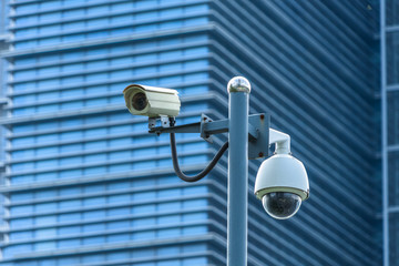 close-up view of security camera, in front of office building..