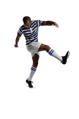 Plakat Full length of male rugby player kicking