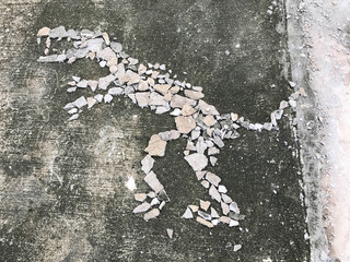 Dinosaurs caused by the small stones placed in a row make from children.