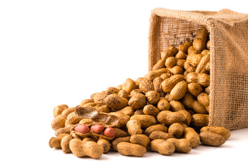 Peanuts in burlap bag on white background.