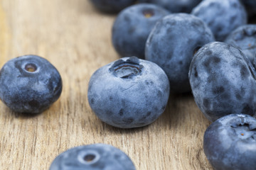 some blueberries on a wooden table