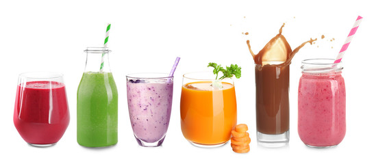 Different protein shakes in glassware on white background