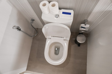 Toilet bowl in modern restroom
