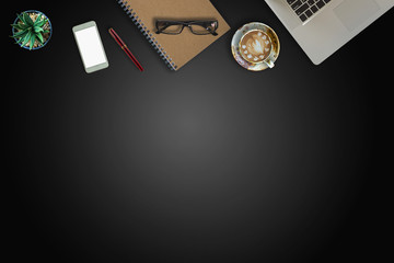 Modern dark surface office desk table with computer and cup of coffee. Hero Header Concept with Copy space.	