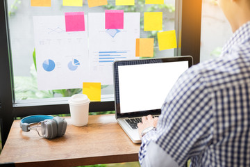 Authentic image of a pensive businessman in a coffee shop sitting in cafe and working with laptop