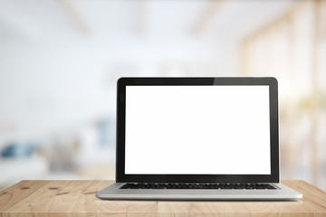 Workspace with laptop computer in office. Mock up blank screen for graphic montage.