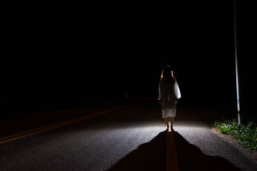 Mysterious Woman, Horror scene of scary ghost woman standing outdoor on street with light