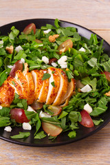 Chicken, grape, arugula, cheese and walnuts salad, vertical