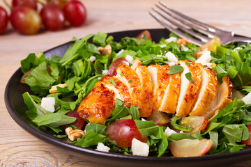 Chicken, grape, arugula, cheese and walnuts salad, horizontal