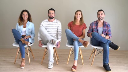 Group of people in waiting room talking to each other