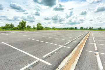 Empty parking lot against a beautiful blue sky