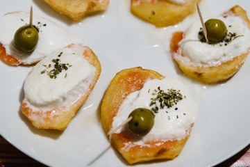 Table at home with pintxos and tapas.