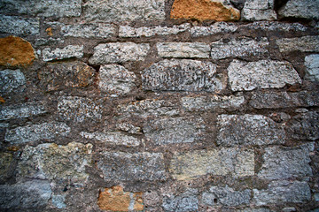 Texture of an ancient brick wall with concrete