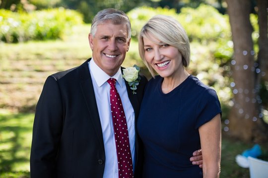 Portrait Of Happy Couple Attending A Wedding