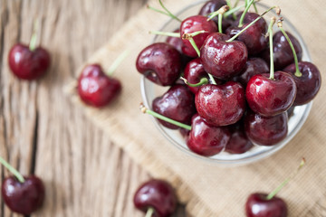 red cherry on wooden background