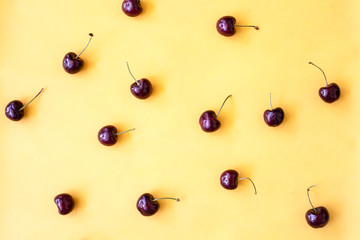 red cherry on yellow background
