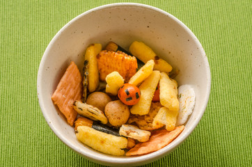 Snack for drinking time on the green tablecloth