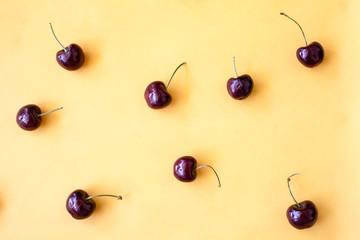 red cherry on yellow background
