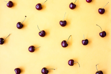 red cherry on yellow background