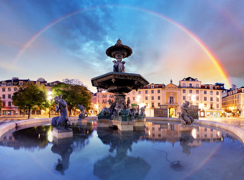 Rainbow over  Rossio square in Lisbon Portugal