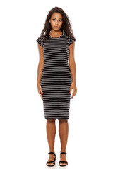 young and pretty dark skinned woman posing on white background