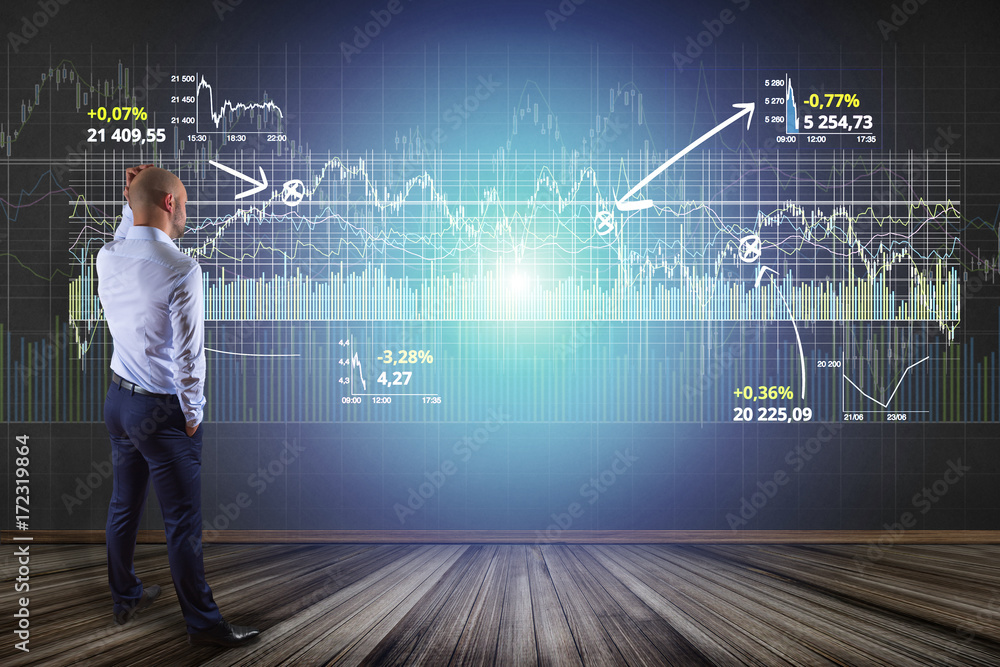 Poster man in front of a wall writing on a stock exchange interface - tradex concept