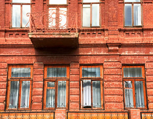 Fototapeta na wymiar Brick building industrial facade with multiple windows. Industrial background.