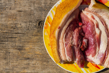 Fresh raw pork belly on wooden table
