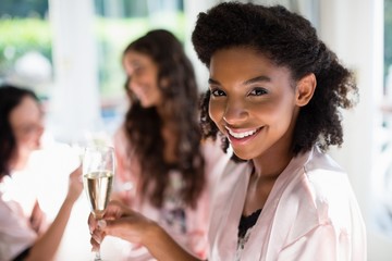 Woman holding a glass of champagne