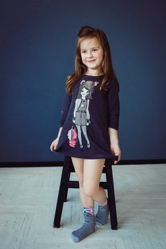 Little girl in socks with owls