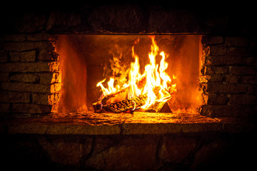 Yellow bright flames in the fireplace