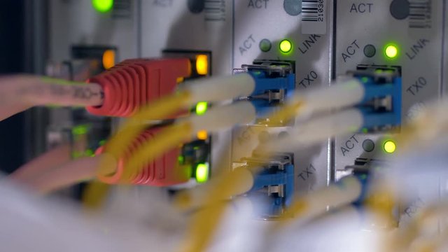 Flashing LED lights at working data servers. 4K. - Powered by Adobe