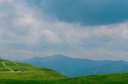 Skydivers in the sky over the Caucasus Mountains, Georgia.