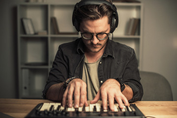 man working with keyboard controller