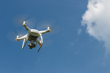 White aircraft for aerial filming in the sky.